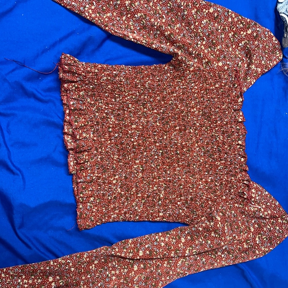 This is a floral maroon crop top and is super cute for concerts etc.